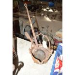 An old iron glue pot and two ladles