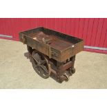 A French style wooden framed cart with iron wheels