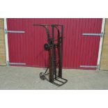 A Vintage cast iron and wooden sack lifter, conver