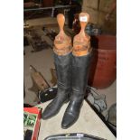 A pair of leather riding boots and trees by Peal &