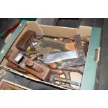 A box containing various wooden planes, screwdrive