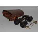 A pair of Ex WD binoculars by Barr & Stroud, with le