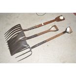 A stone fork; a smaller fork and a shovel