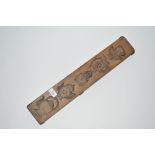 An 18th Century wooden double sided carved gingerb