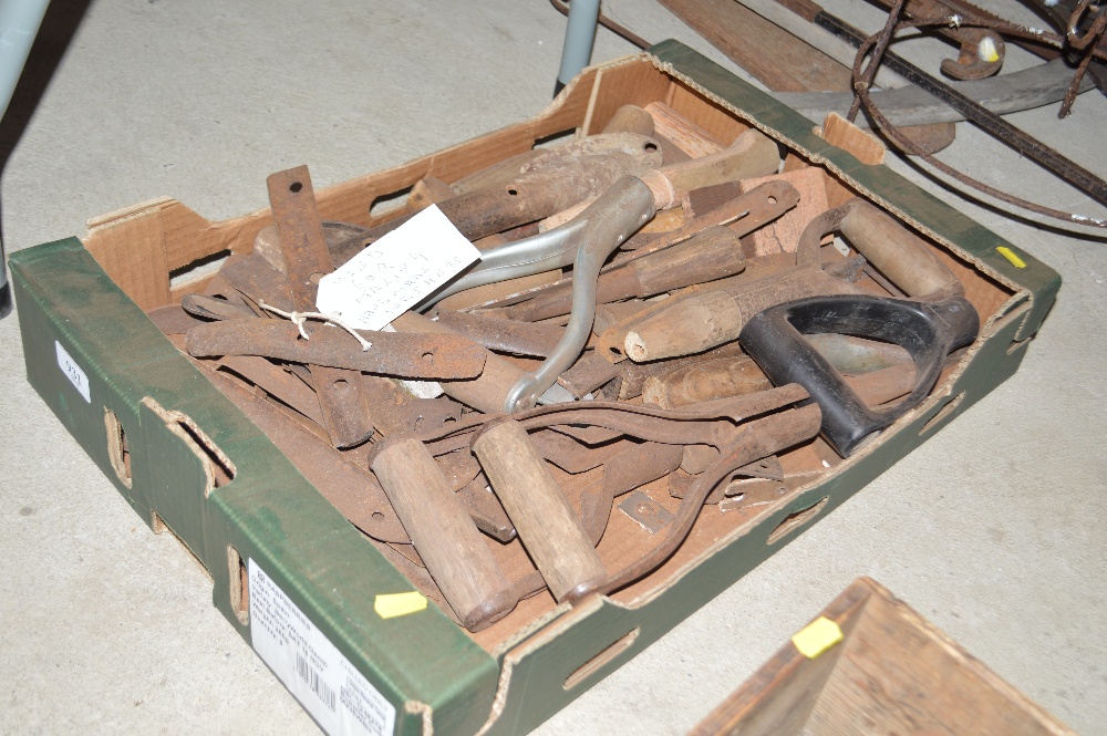 A box of small hand tools and handles