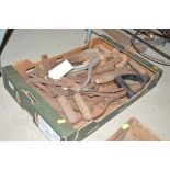 A box of small hand tools and handles