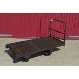 An Antique Nut Company cart with iron handle