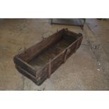 A large Vintage wooden and cast iron trough