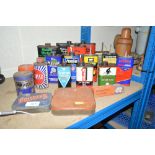 A collection of various old oil cans etc.