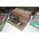 A walnut cased Frister & Rossman sewing machine