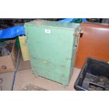 A green painted military box with webbing carrying