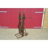 A Vintage cast iron and wooden sack lifter