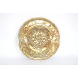 A large Antique brass alms dish, 21ins dia. approx.