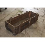 A large Vintage wooden and cast iron trough
