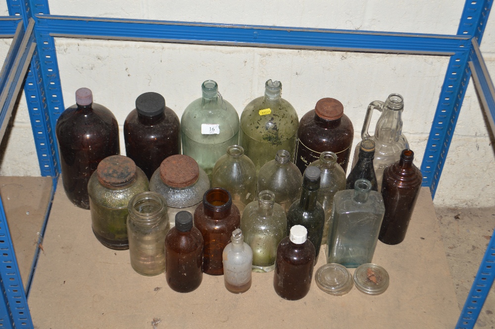 A collection of various Antique bottles and jars i