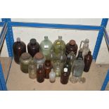 A collection of various Antique bottles and jars i