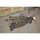 A cast iron and brass mounted grate and various br