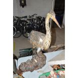 A preserved heron, sat on wooden naturalistic base