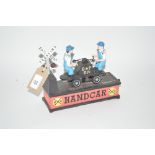 A novelty cast iron moneybox, "Hand Car"