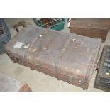 A brown canvas and battened travelling trunk