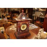 An early 20th Century oak cased mantel clock