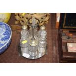A silver plated six bottle cruet stand