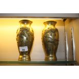 A pair of Japanese polished bronze vases overlaid