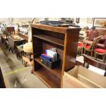 A late Victorian mahogany open fronted bookcase wi