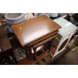 A nest of three oak occasional tables