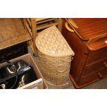 A cane and wicker linen basket