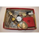 A tray of cutlery, pen knives, sugar tongs, coins