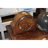 An oak cased three hole mantel clock