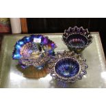 Three Carnival glass bowls, one decorated with pea