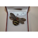 A decorative costume brooch in the form of a bee