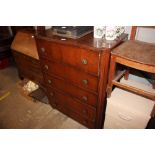 An oak veneered five drawer chest