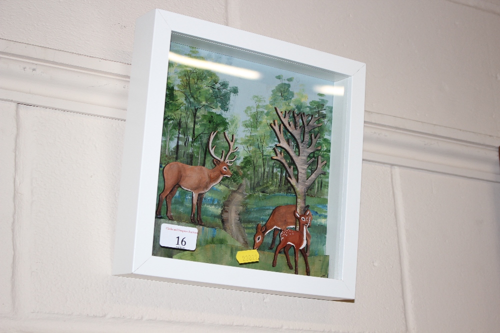 A framed and glazed oil study of three deer in a f