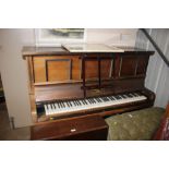 A mahogany upright pianola by Philomelle of London