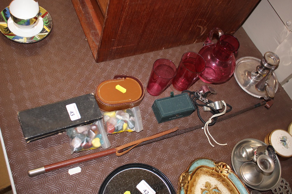 A cranberry glass jug; two beakers; a silver plate