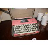 An Olympia portable typewriter in carrying case