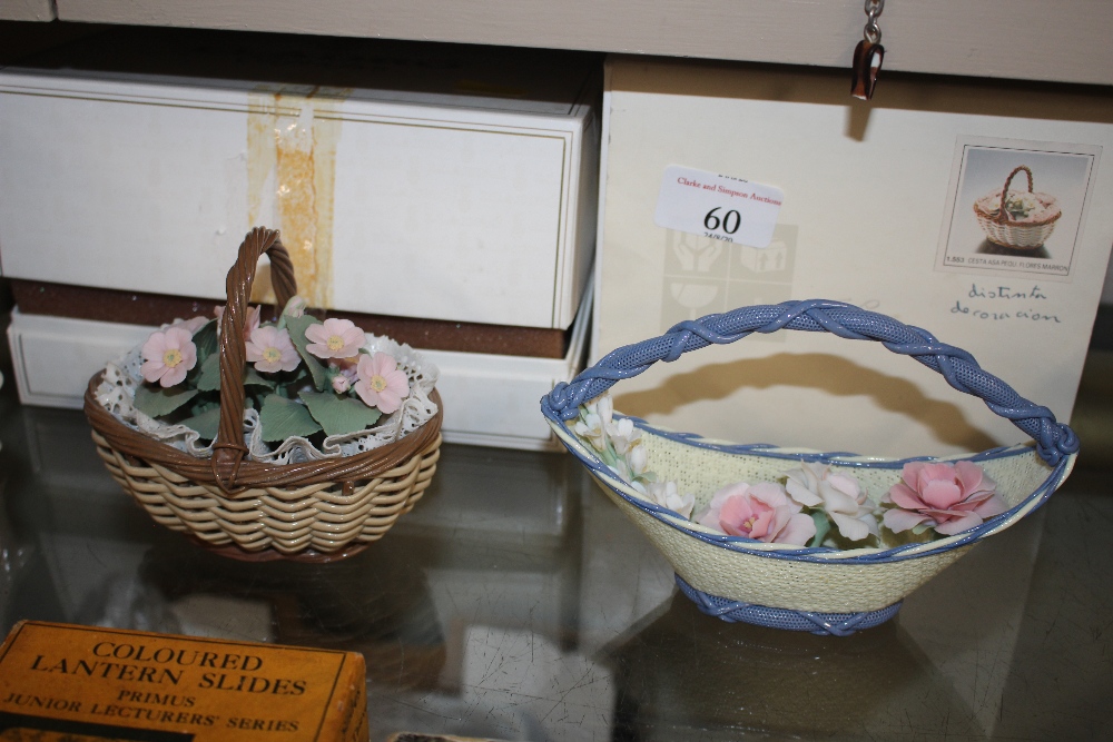 Two Lladro baskets with flowers