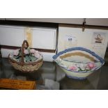 Two Lladro baskets with flowers