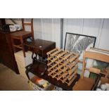 A reproduction mahogany drop leaf table; a wine ra