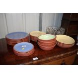 A quantity of Denby dinner plates and a large glas