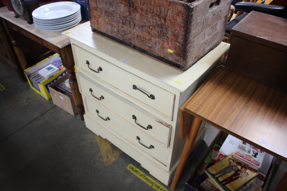 A painted chest fitted three drawers