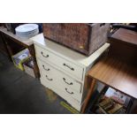 A painted chest fitted three drawers