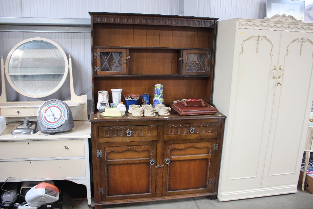 An oak and leaded glazed dresser