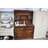 An oak and leaded glazed dresser