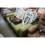 A DFS green upholstered two seater settee