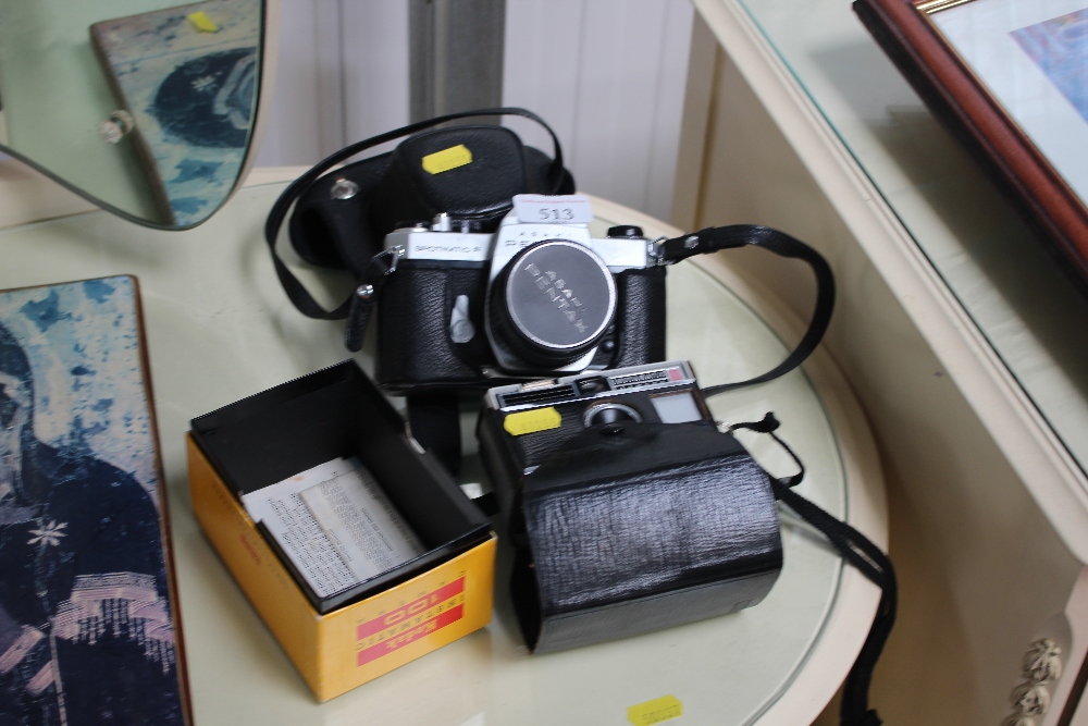 A Pentax camera and one other