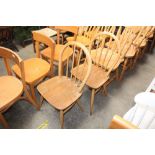 A pair of Ercol stick back dining chairs